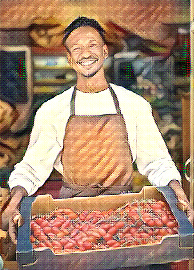 A man holding a container of fruits in front of a gate